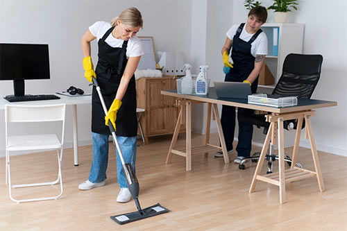 Home Care Provider Cleaning the room
